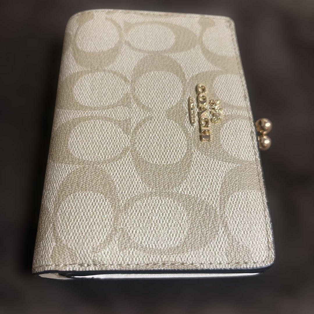 シロクマ COACH ゴールド 二つ折り財布